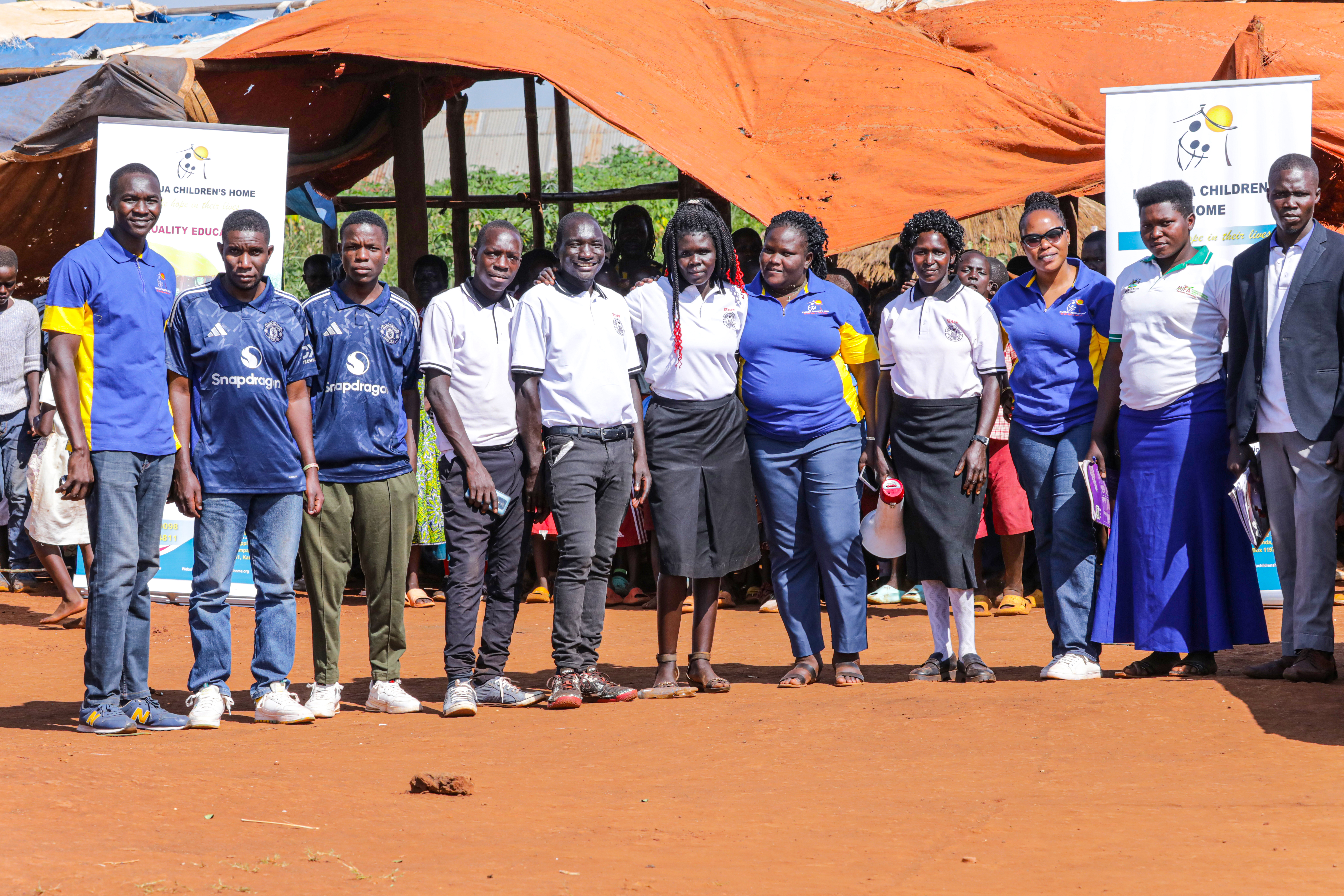 Director with teachers and volunteers